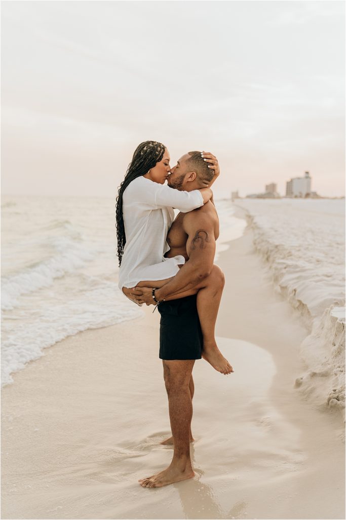 couple kissing on beach