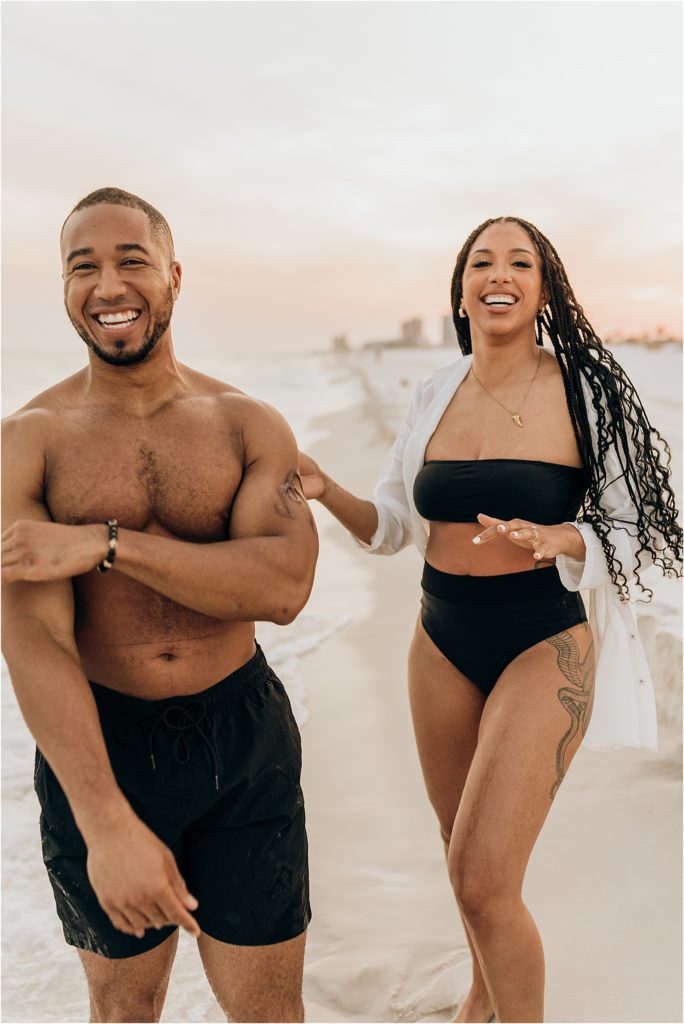 couple laughing on beach