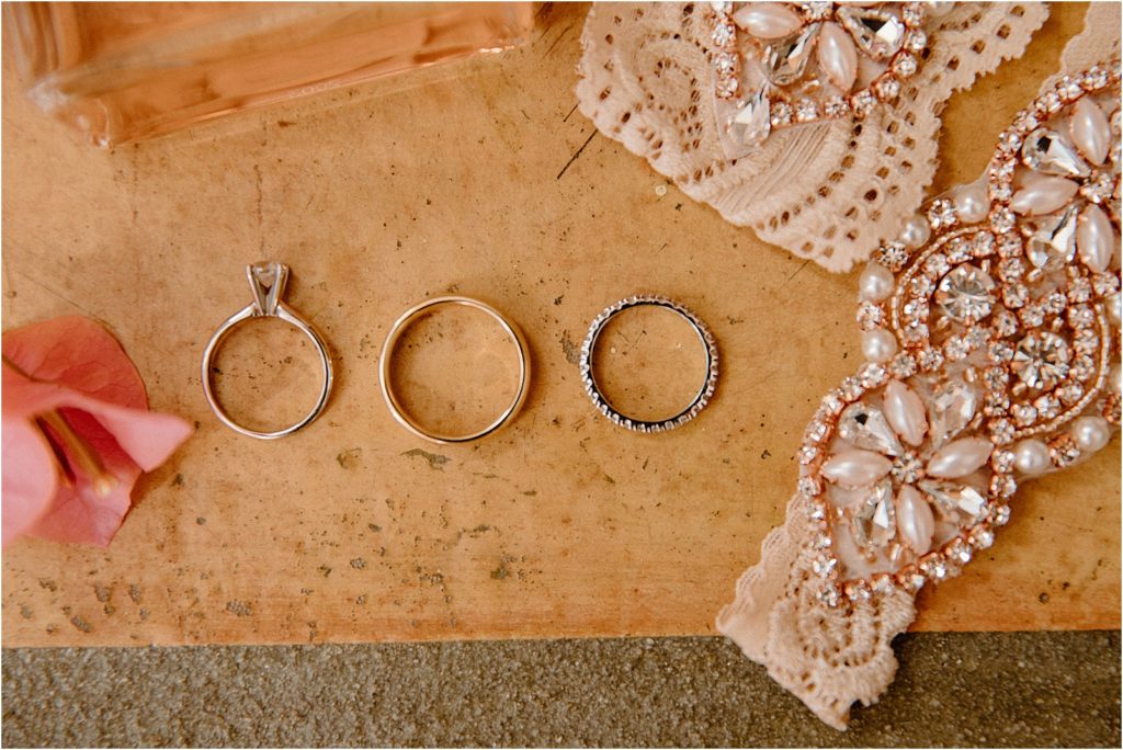 Bride and groom's rings at backyard palm springs wedding venue