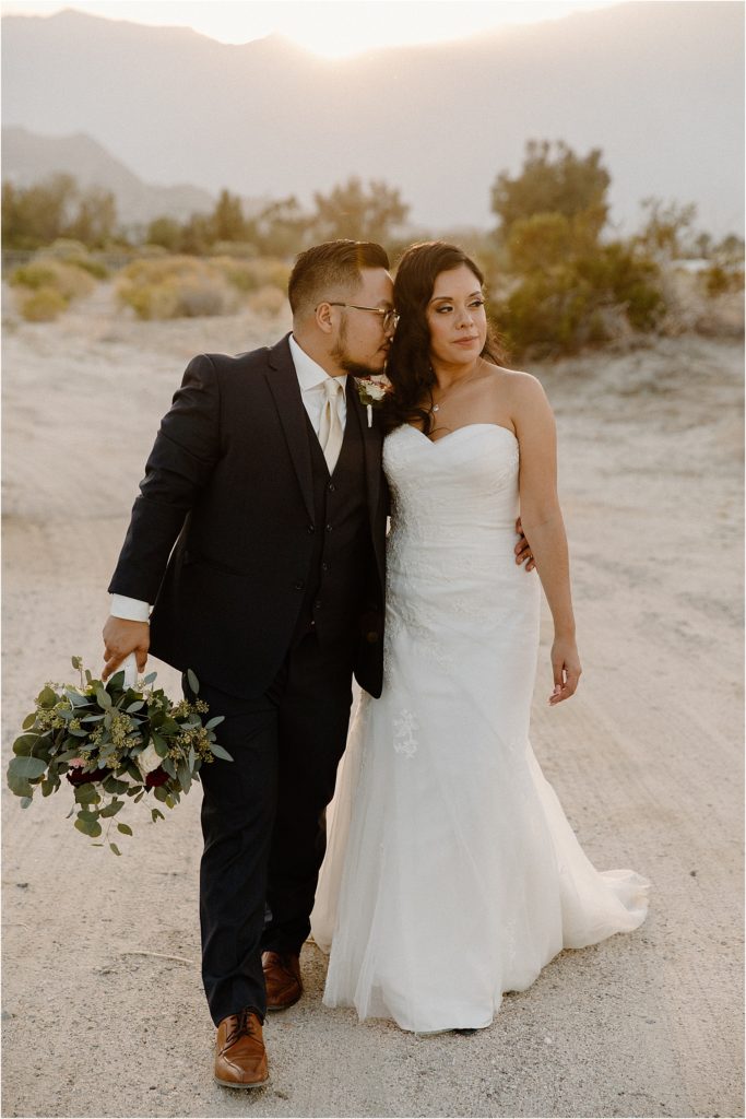 wedding couple walking in palm springs desert