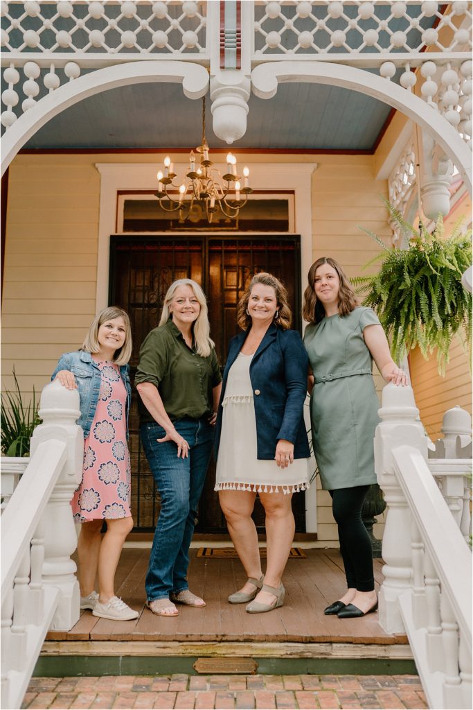 Swanson Signature Events team in front of Gingerbread House Wedding Venue 