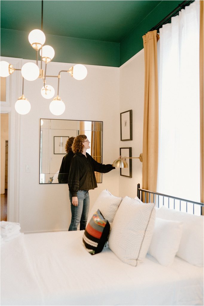 Jen touring Gingerbread House Wedding Venue upstairs bedroom