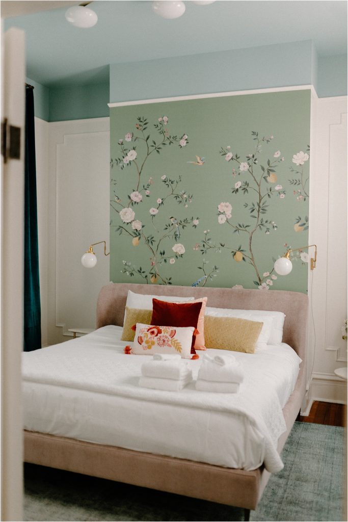 Gingerbread House Wedding Venue Primary bedroom pink velvet bed