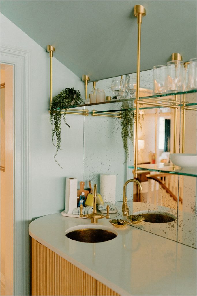 Kitchenette with antique glass and brass shelves
